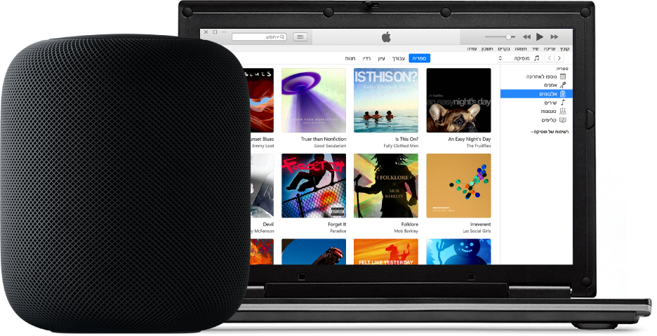 מחשב PC עם תצוגת iTunes על המסך ומכשיר HomePod לידו.