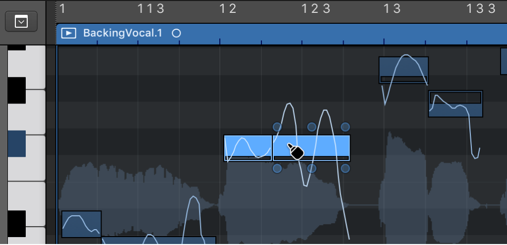 Figure. Fusion de deux notes à l’aide de l’outil Colle dans l’éditeur de piste audio.