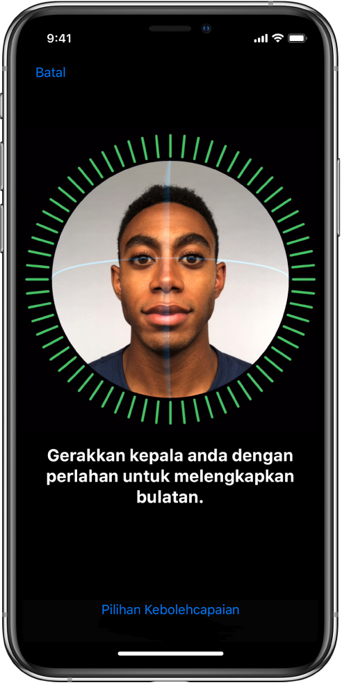 Skrin persediaan pengecaman Face ID. Muka ditunjukkan pada skrin, dikurung dalam bulatan. Teks di bawahnya mengarahkan anda untuk menggerakkan kepala dengan perlahan untuk melengkapkan bulatan.