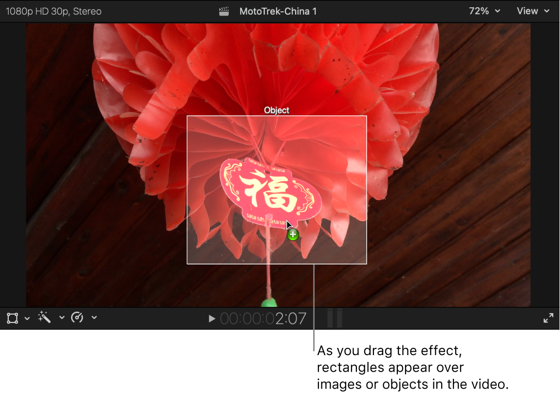 An effect being dragged to the viewer and a white rectangle appearing over an object in the video