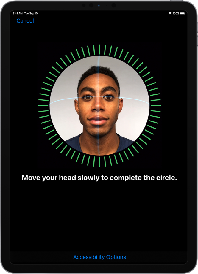 The Face ID recognition setup screen. A face is showing on the screen, enclosed in a circle. Text below that instructs you to move your head slowly to complete the circle.