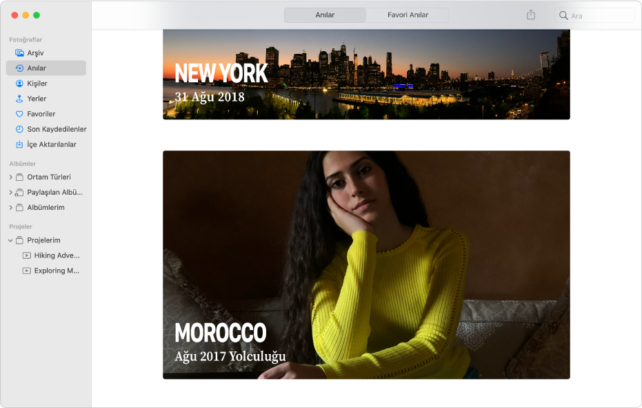 Kenar çubuğunda Anılar’ı seçili olarak gösteren ve pencerede iki anının görüntülendiği Fotoğraflar penceresi.