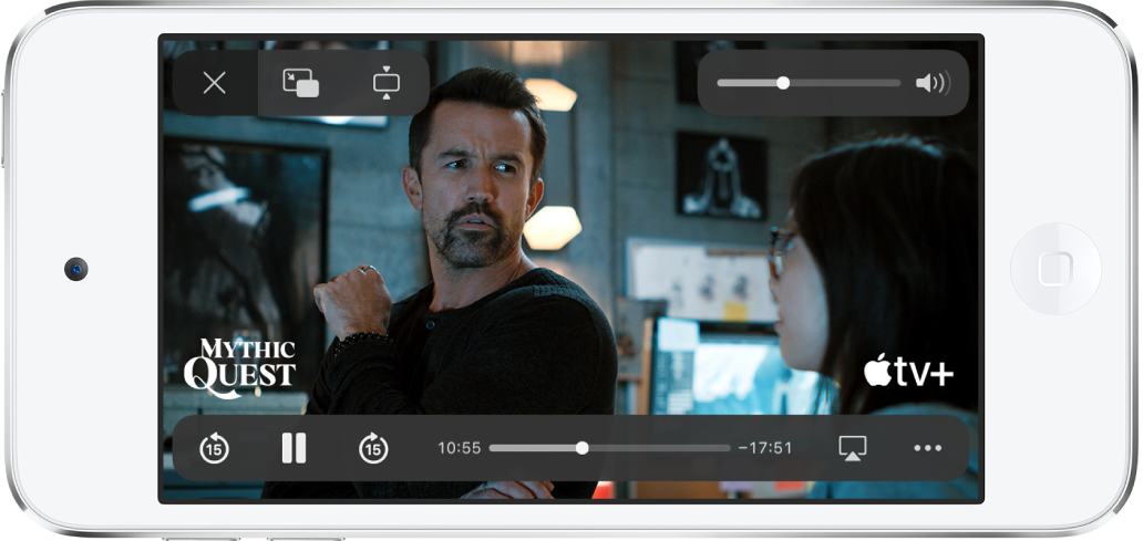 Filme sendo reproduzido, com os controles aparecendo. Os botões Fechar, PIP e Zoom estão na parte superior esquerda. O controle deslizante de volume está na parte superior direita. Na parte inferior esquerda, os botões para retroceder 15 segundos, pausar e avançar 15 segundos. Ao longo da parte inferior central, um controle deslizante que pode ser arrastado para ajustar a posição do vídeo; o tempo decorrido e o tempo remanescente aparecem em cada um dos lados do controle deslizante. Na parte inferior direita, há botões para alterar o destino do vídeo e mostrar mais controles.