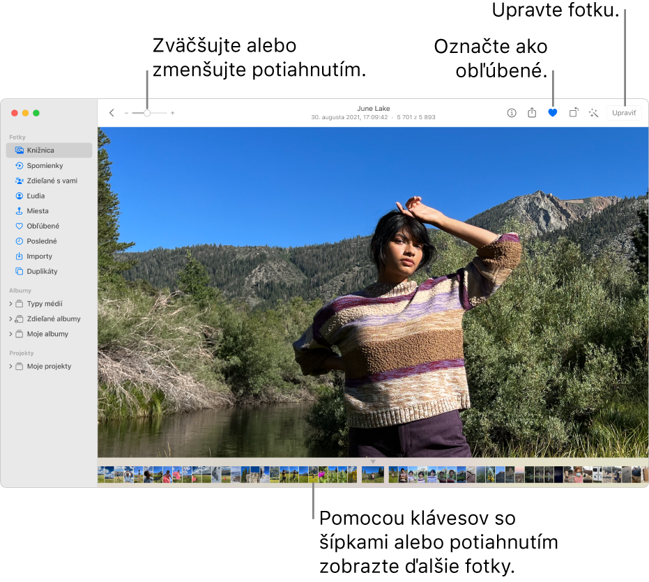 Okno Fotky so zobrazením zväčšenej fotky napravo s radom miniatúr nižšie. Panel nástrojov navrchu zahŕňa posuvník zväčšenia, tlačidlo Obľúbené a tlačidlo Upraviť.