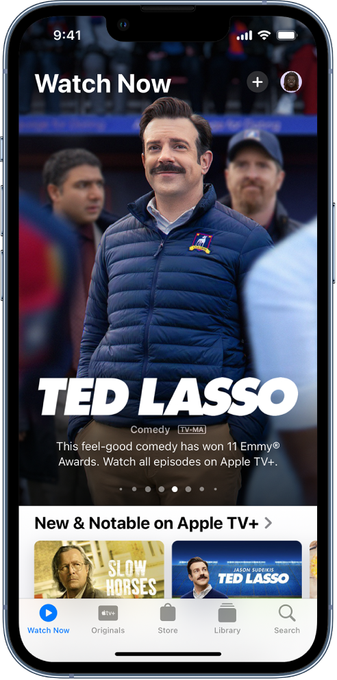 The Watch Now screen showing a featured TV show in the center, above the New & Notable on Apple TV+ row. At the bottom, from left to right, are the Watch Now, Originals, Store, Library, and Search tabs.