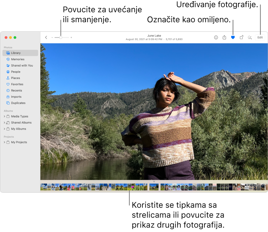 Prozor aplikacije Foto s prikazom uvećane fotografije na desnoj strani i redom minijatura ispod nje. Alatna traka na vrhu uključuje kliznik za zumiranje, tipku Omiljeno i tipku Uredi.