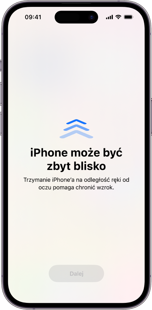 Ekran z ostrzeżeniem, że trzymasz iPhone’a zbyt blisko i należy odsunąć go od oczu, aby chronić swój wzrok. Ostrzeżenie zasłania ekran i uniemożliwia dalsze korzystanie z urządzenia. Na dole widoczny jest przycisk Dalej, który staje się aktywny po odsunięciu iPhone’a na bezpieczną odległość od oczu.