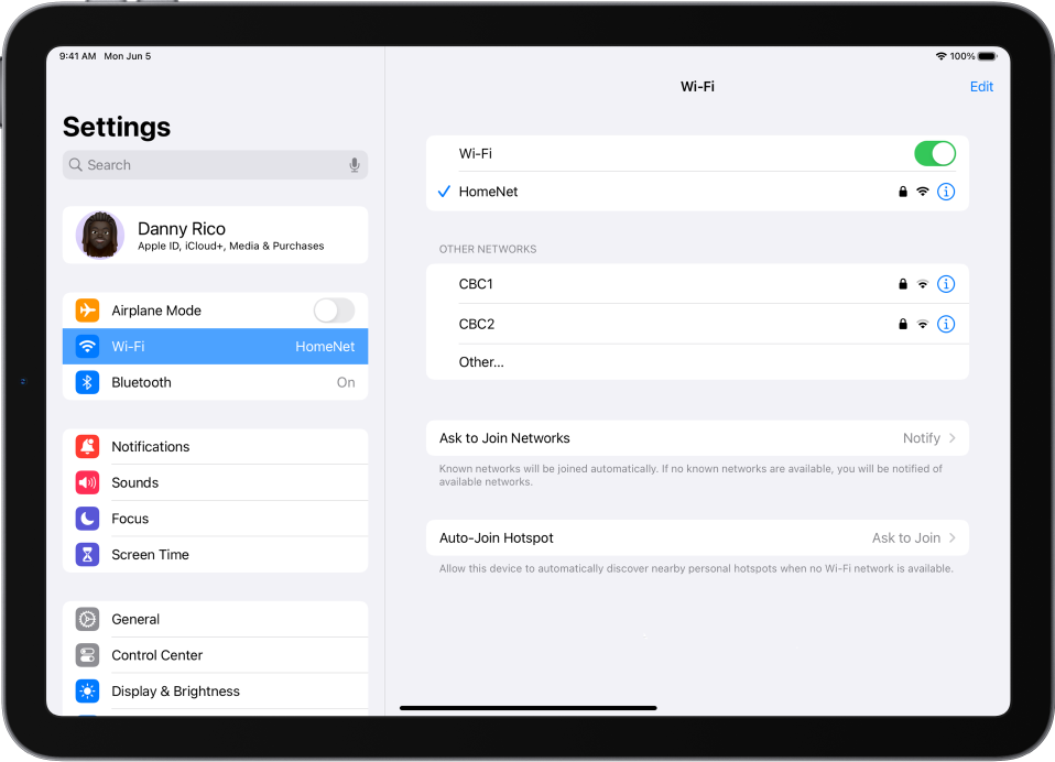 The Settings sidebar is on the left side of the screen and Wi-Fi is selected. On the right side of the screen, Wi-Fi is turned on, and a network is selected.