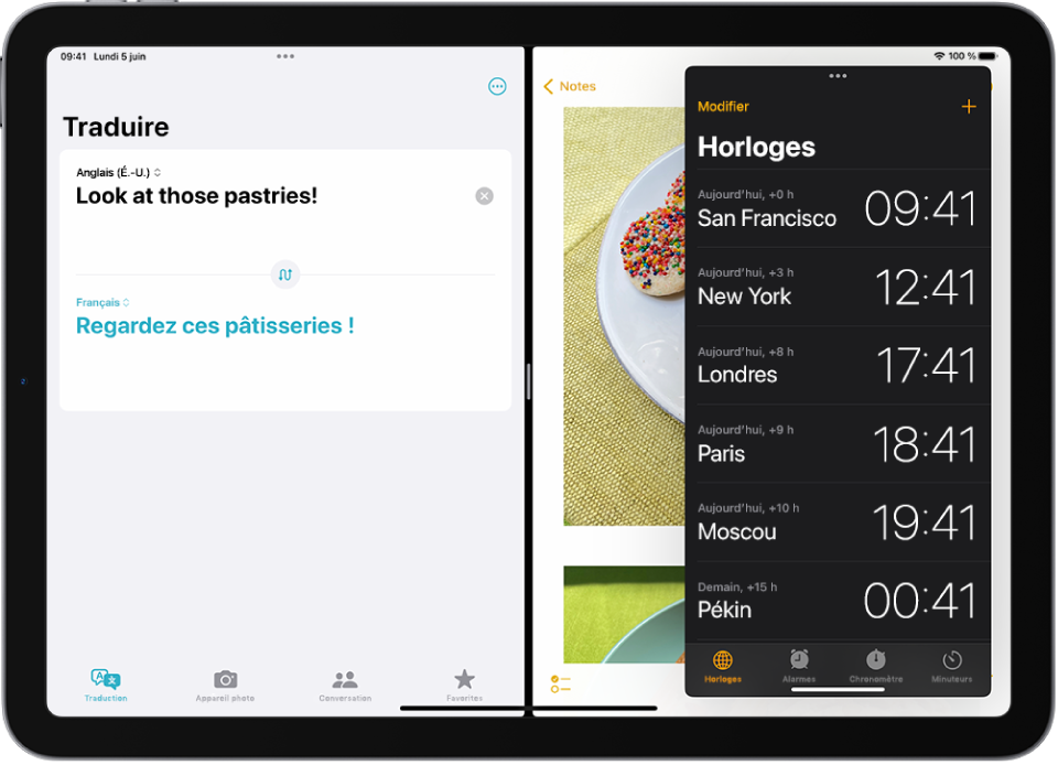 L’app Traduire est ouverte sur le côté gauche de l’écran, Notes est ouvert sur la droite et Horloge est ouvert dans une fenêtre Slide Over qui couvre partiellement Notes.