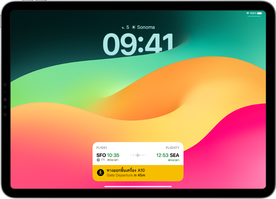 หน้าจอล็อค iPad ที่มีกิจกรรมสด โดยมีตัวติดตามเที่ยวบินแสดงเวลาที่ใช้ในการบินและช่วงเวลาออกเดินทางที่คาดไว้สำหรับเที่ยวบินที่ถูกติดตาม