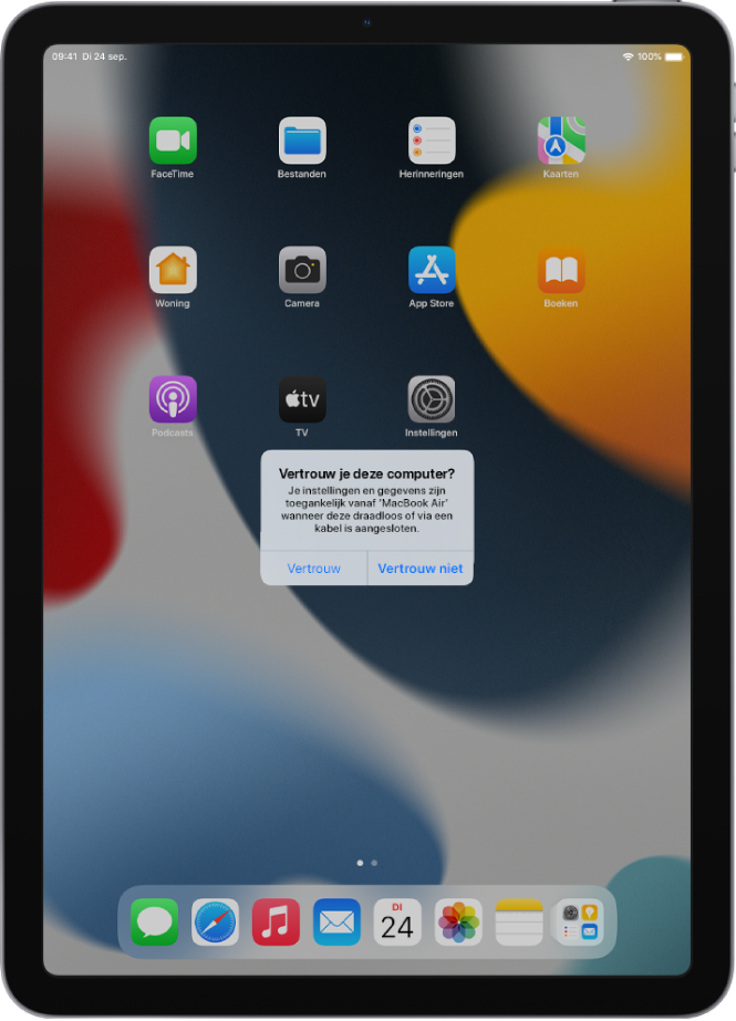 Een iPad met het dialoogvenster 'Vertrouw je deze computer?' als de iPad voor het eerst op een MacBook Pro wordt aangesloten.