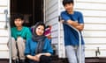 Afghan refugee Sakineh with her sons Ehsan and Erfan on their back doorstep