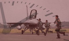 Taiwan air force pilots run toward F-16V fighter jets during a military drill.