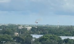 A still showing a helicopter falling from the sky.