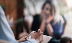 Stock image of a woman talking to a mental health professional