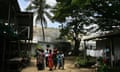 To accompany feature Health-AIDS-Papua<br>Men, women and children who have tested positive to HIV congregate at a safe-house in a settlement in Port Moresby. The jungle-clad mountainous South Pacific nation of Papua New Guinea is on the verge of exploding into an African-style AIDS epidemic which could wipe out millions, but sorcery, shame and an ailing health system are hindering the fight against the deadly disease. Those fighting AIDS say the belief in sorcery is widespread and infected people in remote villages are sometimes thrown into rivers to drown or dumped in graves to die, while in the capital Port Moresby the stigma of AIDS sees people abandoned at the hospital or left on the street. Picture taken October 28, 2005. To accompany feature Health-AIDS-Papua REUTERS/David Gray