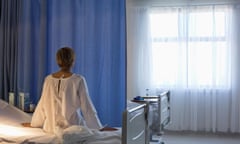 patient wearing gown on hospital bed