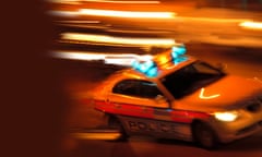 Police car at night, blurred motion<br>UK, London, Pentonville Road