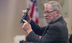 Lucien Haag, an expert in Old West firearms, shows the jury a gun during the trial for Hanna Gutierrez-Reed in Santa Fe, New Mexico. Gutierrez-Reed was the armorer on the set of the movie Rust when cinematographer Halyna Hutchins was shot.