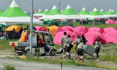 People arriving at scout camping site
