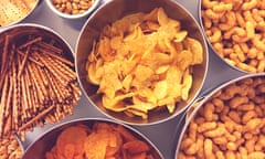 Bowls of crisps, nuts and other snacks