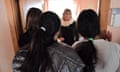 ROMANIA-CHILDREN-TRAFFICKING-CRIMEIana Matei (C), a Romanian psychologist who takes care of minors who have been victims of human trafficking talks with some of the girls there at the reception center near Pitesti city, southern Romania on January 27, 2017. At the reception center set up near Pitesti by the "Reaching Out" association eleven teenagers watch TV, embroidery or tease each other about their favorite stars. All to forget the sufferings. According to official figures, 695 victims of trafficking were identified in 2016 in Romania, compared with 880 the previous year. Most are exploited by networks of Romanian traffickers operating in Italy, Spain, Germany and France. Some of them managed to escape, but "it is mainly