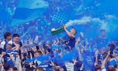 Ipswich players and fans celebrates promotion to the Premier League.