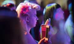 A fan watching live music