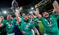 Ireland's Jack Conan, Craig Casey, Andrew Porter, James Ryan, Ryan Baird and Tom O'Toole celebrate winning with the Guinness Six Nations and Triple Crown trophies after their victory over England in  their 2023 Guinness Six Nations match in Dublin.