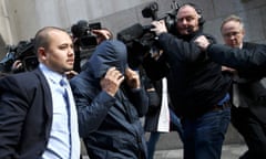 Mazher Mahmood covers his face as he leaves the Old Bailey on 5 October 2016