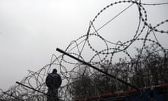 A Hungarian police officer at Serbia’s border with Hungary