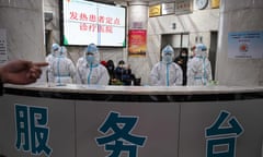 CHINA-HEALTH-VIRUS<br>This photo taken on January 25, 2020 shows medical staff wearing protective clothing to protect against the deadly COVID-2019 coronavirus as they work at the Wuhan Red Cross Hospital in Wuhan. - Doctors on the frontline of China's new coronavirus epidemic are facing a daunting task: treat an ever-growing number of infected patients and risk getting infected themselves due to a drastic shortage of masks and other protective equipment. (Photo by HECTOR RETAMAL / AFP) / TO GO WITH China-health-virus-hospital,FOCUS by Eva Xiao and Ludovic Ehret (Photo by HECTOR RETAMAL/AFP via Getty Images)