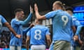 Erling Haaland celebrates with Phil Foden after scoring Manchester City’s second goal against Wolves.