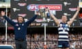 Chris Scott and Joel Selwood lift the premiership cup after thrashing Sydney in the 2022 AFL grand final at the MCG.