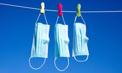 Surgical masks hanging on a washing line<br>2CNB9DH Surgical masks hanging on a washing line