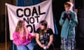 Stacey Sampson (Mary) Claire O'Connor (Isabel) and Victoria Brazier (Olive) talking in front of a banner that says COAL NOT DOLE