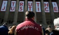 People look at floral tributes in memory of the victims of the Hillsborough disaster, at St Georges Hall in Liverpool.