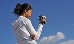 Teenage girl video filming with a hand-held camera