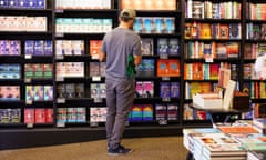 a man browses the shelves at Waterstones