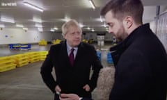 The prime minister, Boris Johnson, with reporter Joe Pike