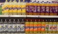 Stock image of soft drink bottles on a supermarket shelf