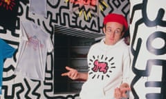 Keith Haring poses at the opening of Pop Shop.