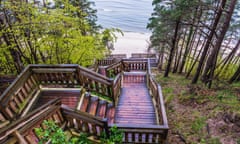 View from the top of wooden stairs on Baltic Sea beach in Miedzyzdroje seaside resort on Wolin Island in West Pomeranian Voivodeship of Poland.<br>KNBW40 View from the top of wooden stairs on Baltic Sea beach in Miedzyzdroje seaside resort on Wolin Island in West Pomeranian Voivodeship of Poland.