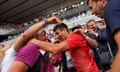 Novak Djokovic celebrates after his record-breaking triumph at the French Open