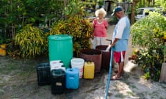 'Water Boy' water vendor delivers water to locals in Gereka. In times of drought, Water Boy prioritises large wealthier clients over the poor. Port Morseby, Papua New Guinea.