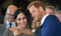 FILE - In this Thursday Jan. 18, 2018 file photo, Britain’s Prince Harry talks to Meghan Markle as they watch a dance performance by Jukebox Collective in the banqueting hall during a visit to Cardiff Castle, Wales. With Prince Harry and Meghan Markle’s May 19 wedding fast approaching, the fashion and bridal worlds are abuzz with talk of who the bride will pick to design her dress and what kind of look she would go for. (Ben Birchall/Pool via AP, File)