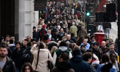 People carrying out last-minute Christmas shopping on Regent Street, London