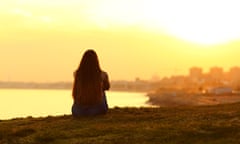 young person looking at sunrise