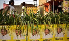 Women walk past campaign posters of Ugandan President Yoweri Museveni in Kampala after he won the presidential election for a fifth term on February 20, 2016.
Uganda's President Yoweri Museveni extended his three-decade rule, after winning a fifth term in polls rejected as fraudulent by the opposition leader under house arrest. The veteran 71-year-old won 60 percent of the vote in the sometimes chaotic elections, far ahead of the 35 percent garnered by detained opposition chief Kizza Besigye, whose house was surrounded by dozens of armed police in riot gear. / AFP / CARL DE SOUZACARL DE SOUZA/AFP/Getty Images