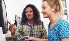 Businesswoman Giving Computer Training In Office